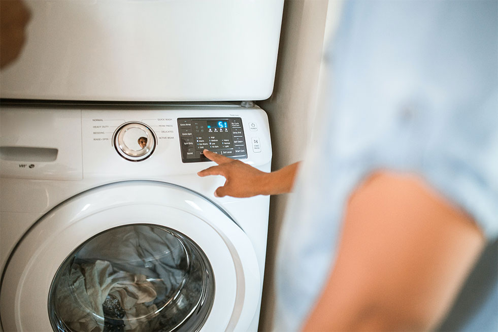 man using washing machine